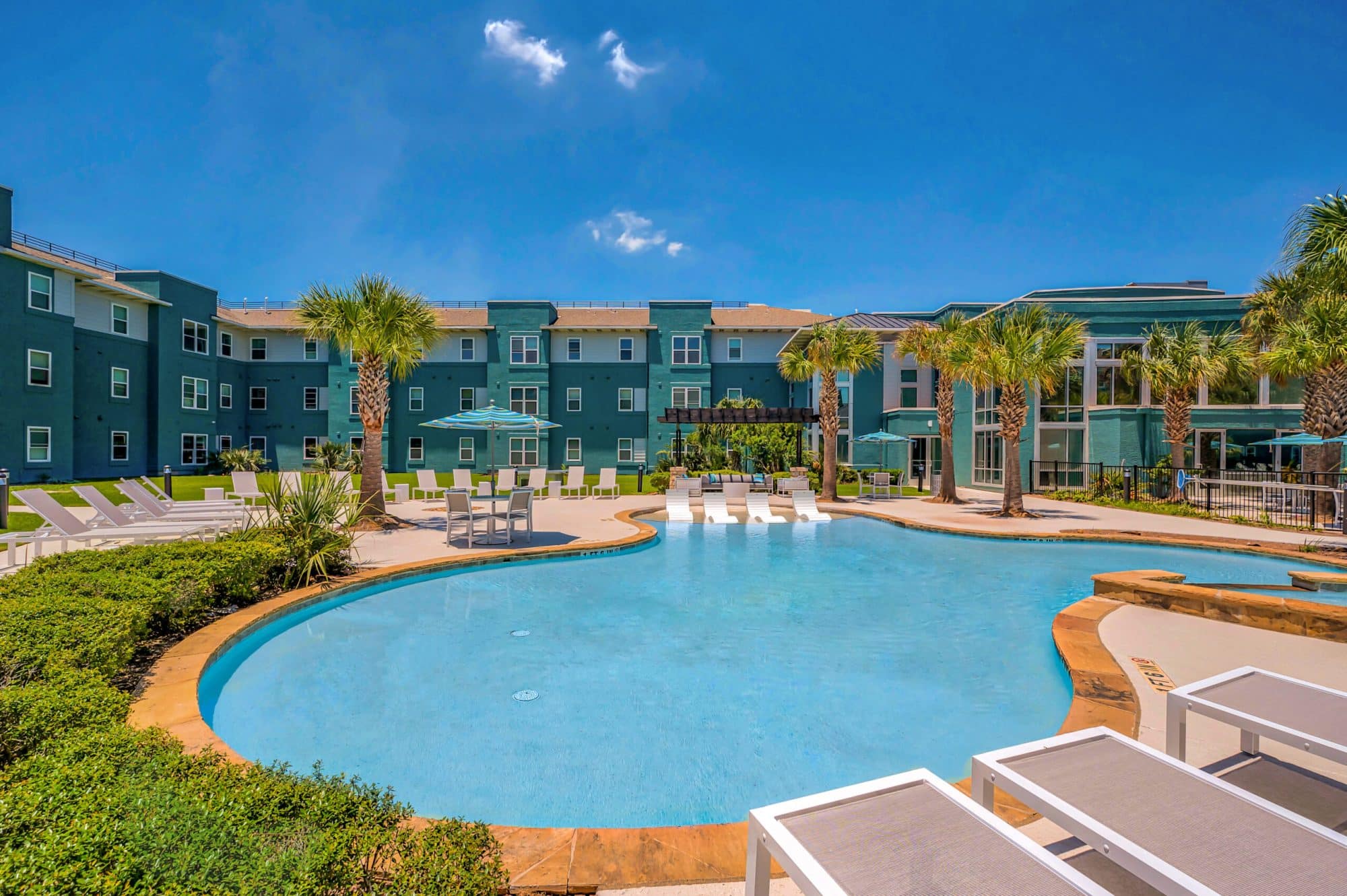 Picturesque view of the pool and community at Cambridge Hall student apartments in College Station, TX.